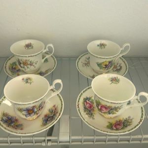 Four tea cups and saucers.